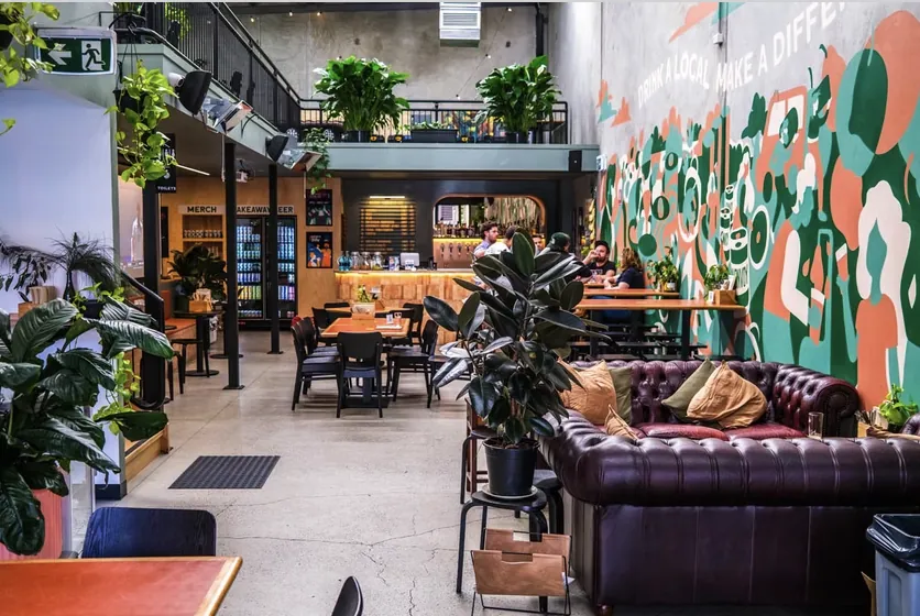 Local Brewing Co. venue with mural and community seating